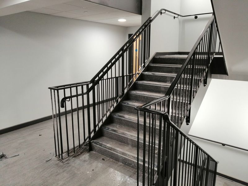 Black powder-coated steel balustrade on a staircase