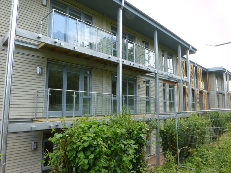 Glass balconies with stainless steel posts and handrails