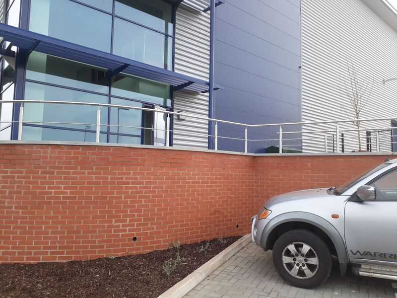 Stainless steel handrail along an external terrace