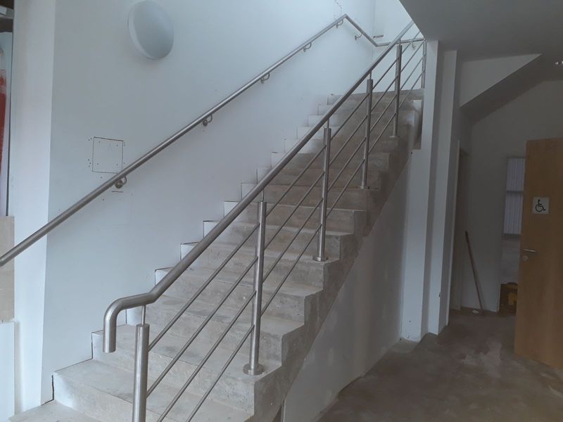 Stainless steel balustrade with handrail on an internal staircase