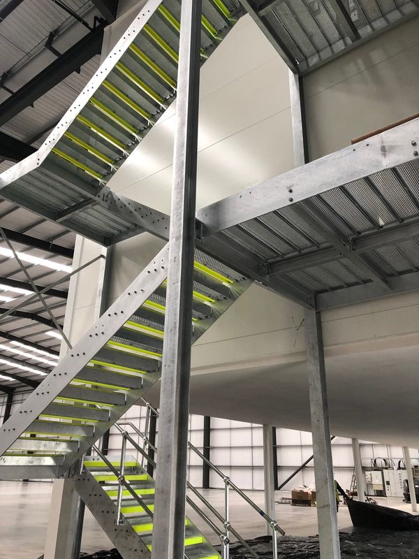 Multi-storey steel stair tower with open treads